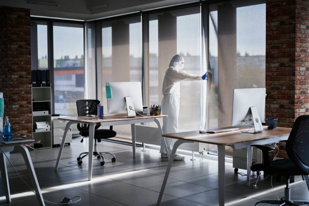 Person in uniform looking out the window